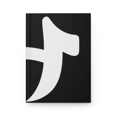 Black notebook with a white abstract design on a white background